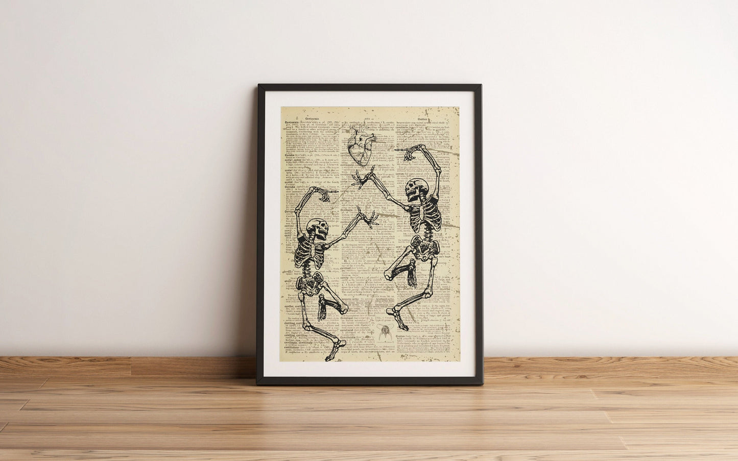 Two Skeletons Dancing Printed On An Antique Old Dictionary Page